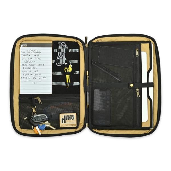 Inside the heritage supply padfolio. Includes zippered pockets, laptop sleeve, keychain, pen and note pad and more. 